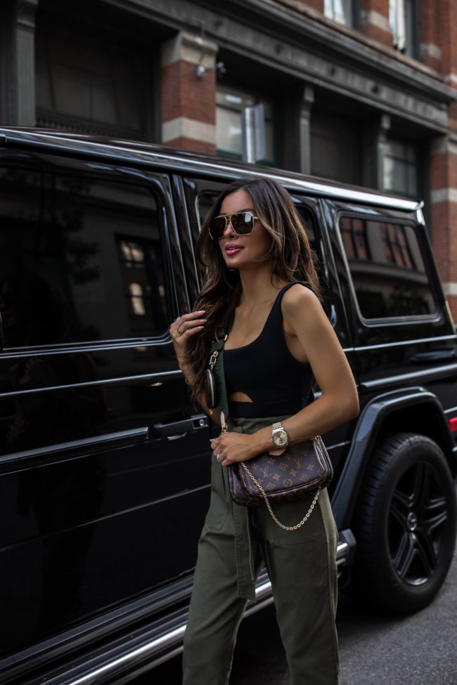 fashion blogger wearing a cutout black bodysuit from abercrombie