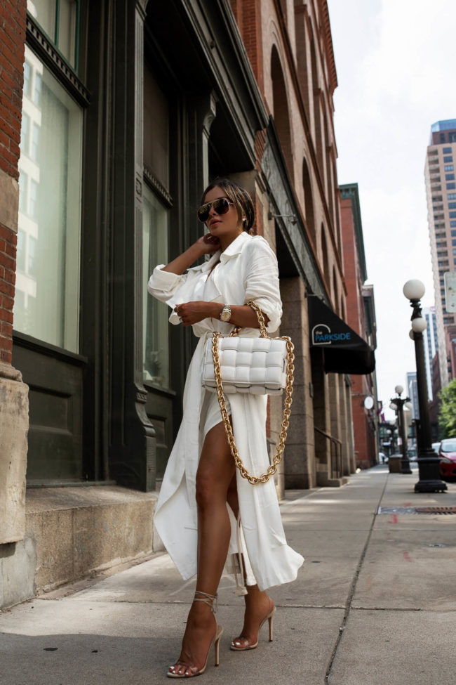 fashion blogger mia mia mine wearing a white trench coat and white linen dress from nordstrom