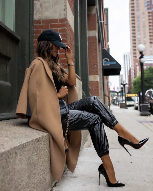 fashion blogger wearing a camel coat and jogger pants from rent the runway