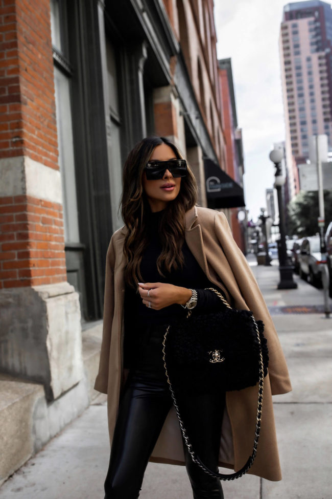 fashion blogger mia mia mine wearing a camel coat and faux leather pants from abercrombie