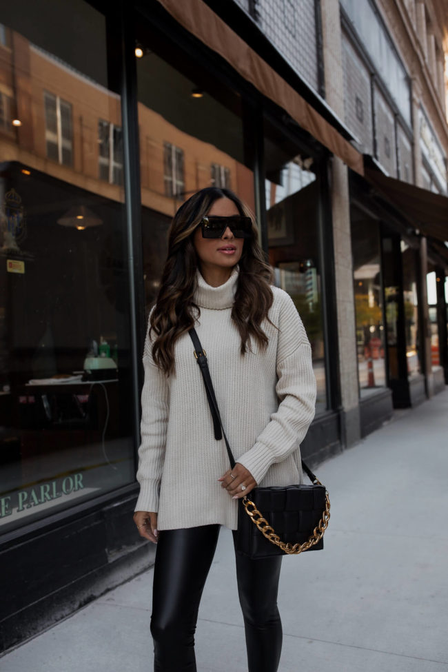 fashion blogger wearing a white sweater from walmart