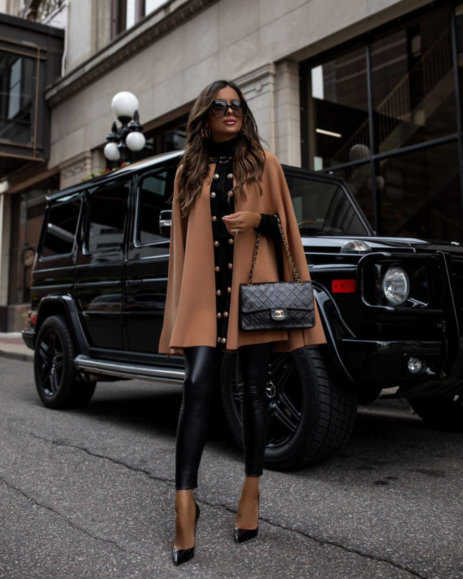fashion blogger wearing a camel poncho from karen millen