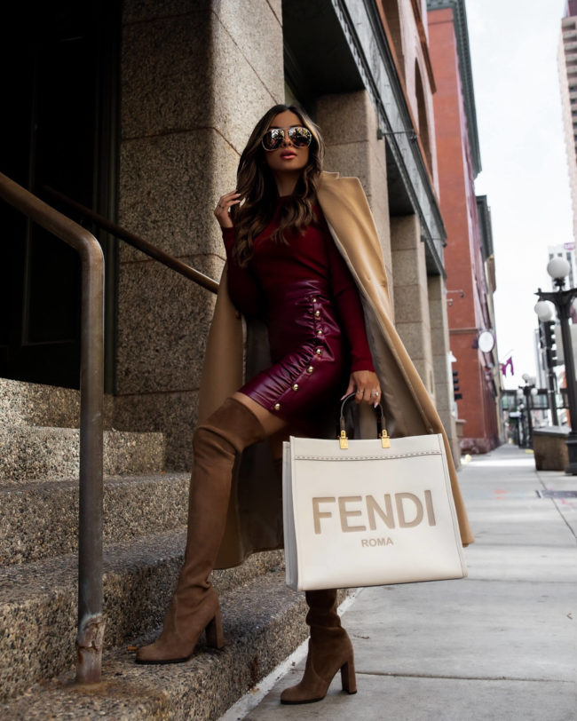 fashion blogger wearing a burgundy faux leather dress from karen millen