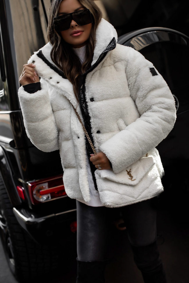 fashion blogger mia mia mine wearing a sherpa white coat from saks fifth avenue