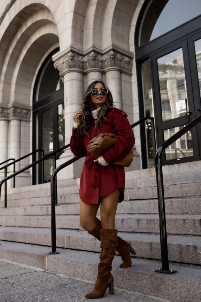 fashion blogger wearing a shacket from walmart and suede boots