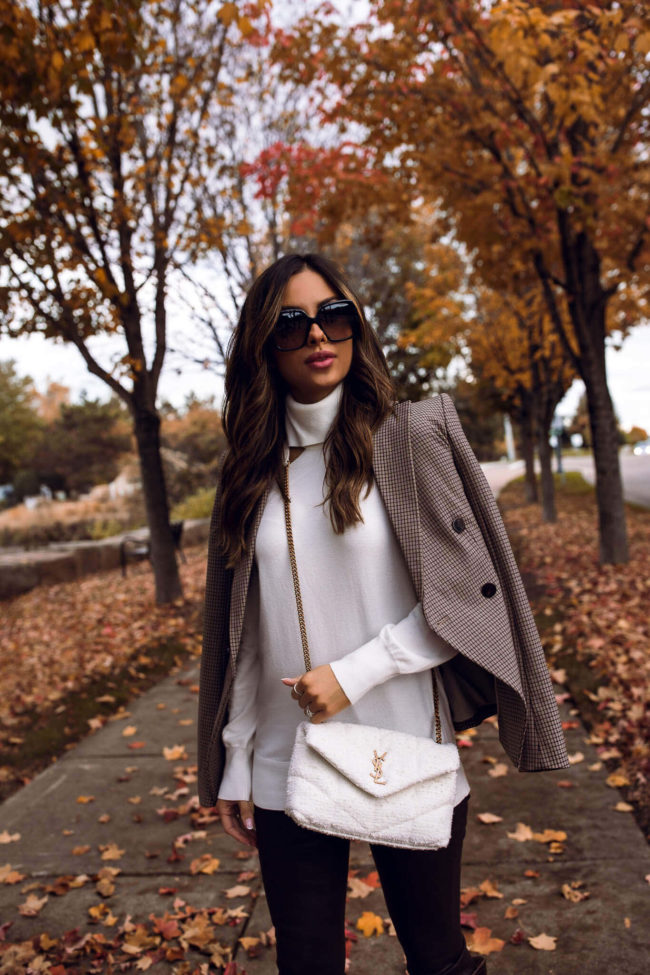 fashion blogger wearing a white toy YSL puffer bag