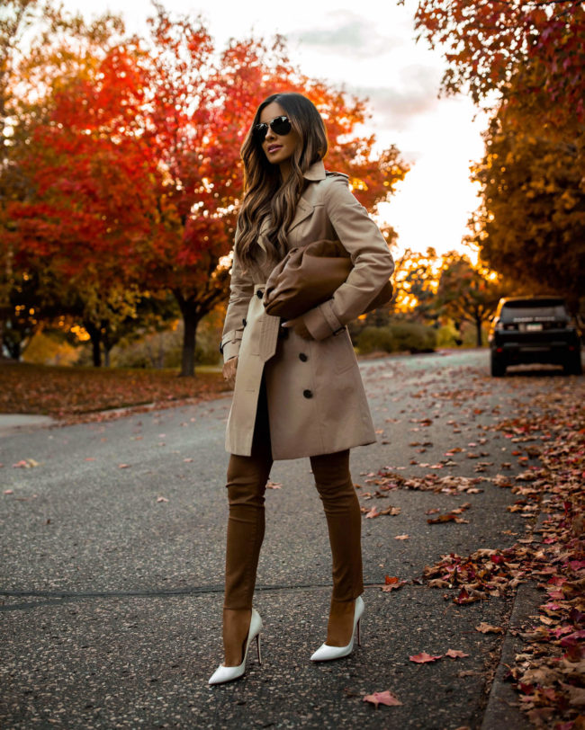 fashion blogger wearing a burberry trench and camel coated denim