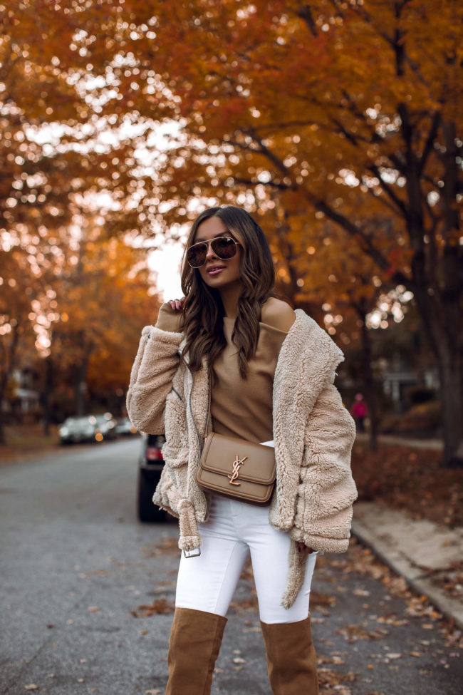 fashion blogger wearing a sherpa free people jacket for fall