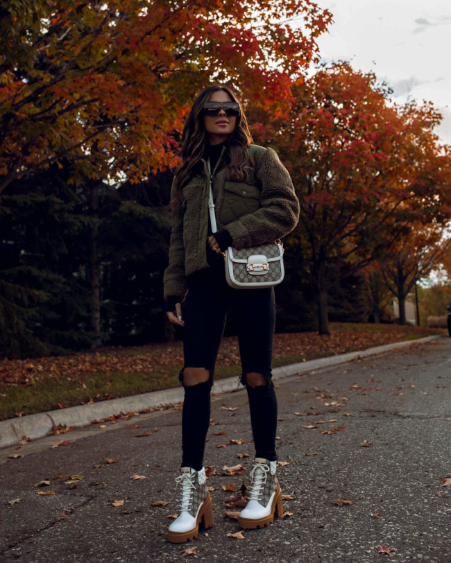 fashion blogger wearing a sherpa jacket by rails from bloomingdale's