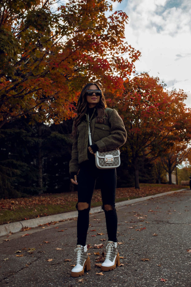 fashion blogger wearing a sherpa jacket by rails from bloomingdale's