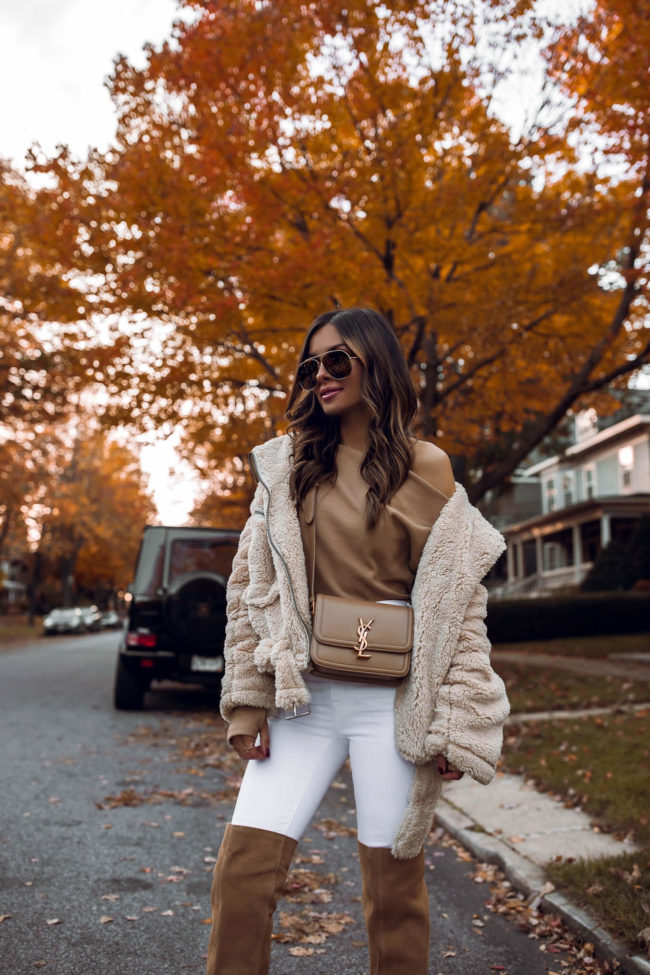 fashion blogger mia mia mine wearing a camel off the shoulder top and saint laurent solferino bag