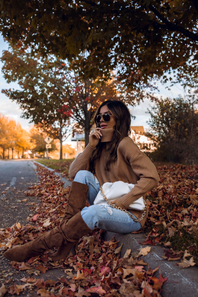 fashion blogger mia mia mine wearing suede boots from walmart and a chunky knit turtleneck sweater