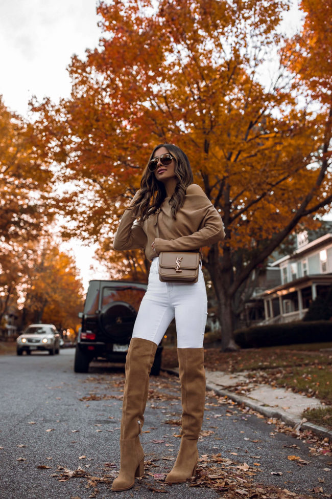 fashion blogger mia mia mine wearing a free people off the shoulder top and white denim from nordstrom