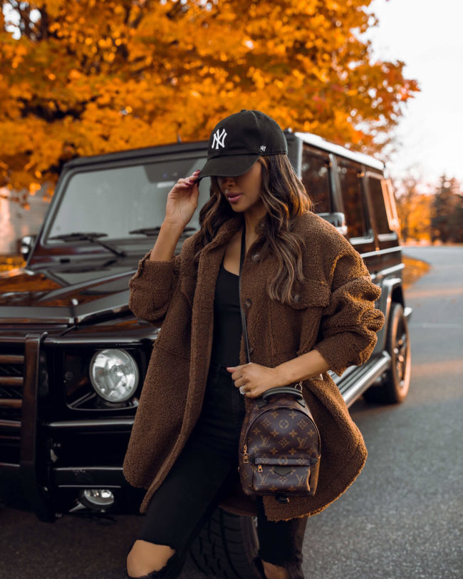 fashion blogger mia mia mine wearing a teddy bear shacket from nordstrom