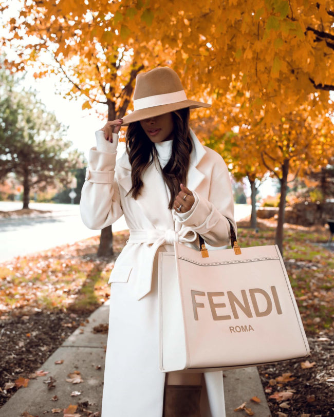 fashion blogger wearing a white coat for fall