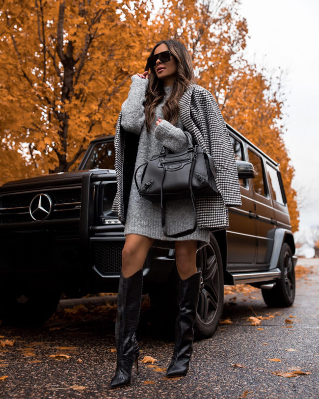 fashion blogger mia mia mine wearing schutz black boots and a sweater dress from nordstrom