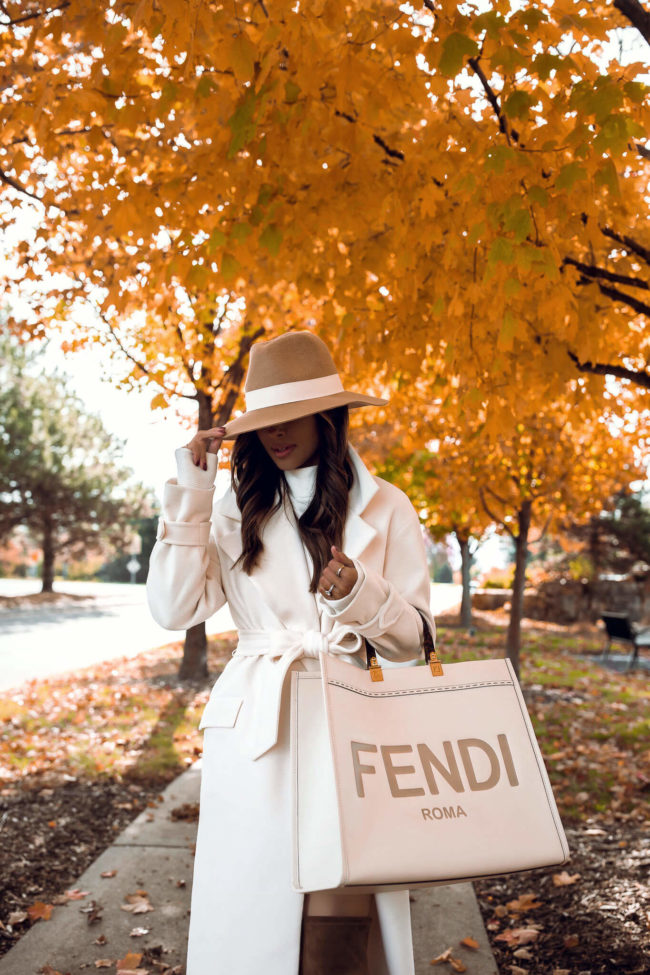 fashion blogger mia mine wearing an express white robe coat for fall