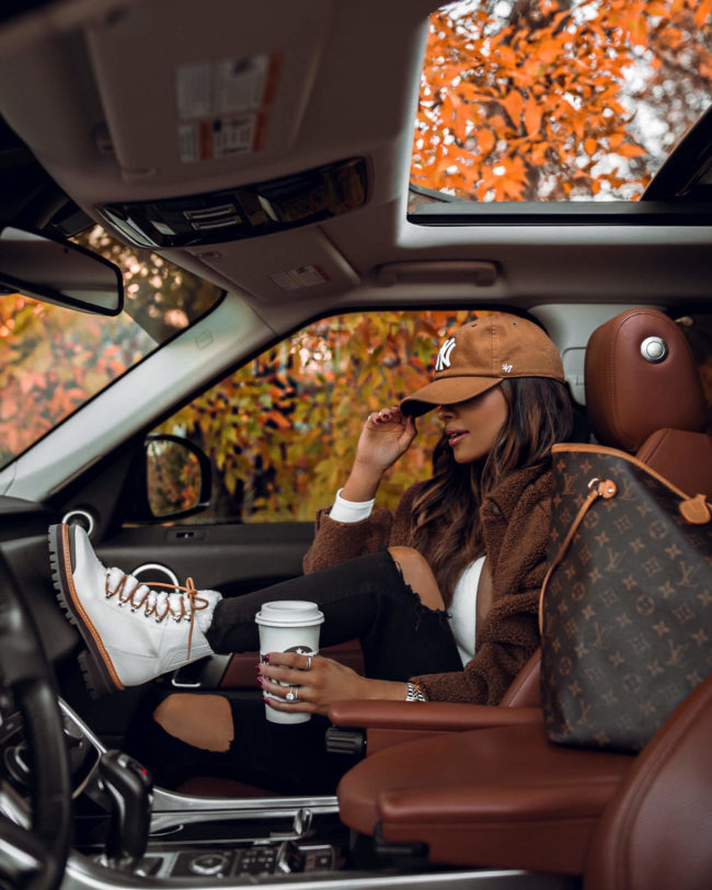 mia mia mine wearing white shearling boots from nordstrom