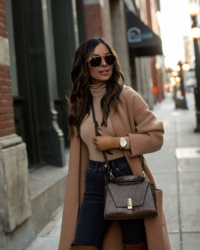 mia mia mine wearing a nine west snakeskin bag with a nine west gold watch