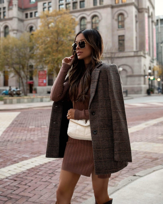 fashion blogger wearing an abercrombie plaid blazer and brown sweater dress