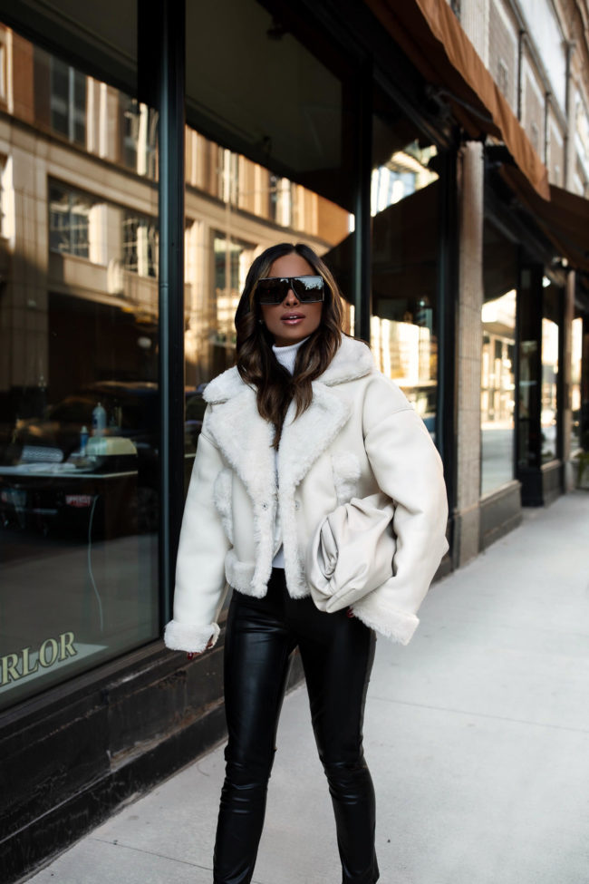 fashion blogger wearing an abercrombie white faux fur jacket