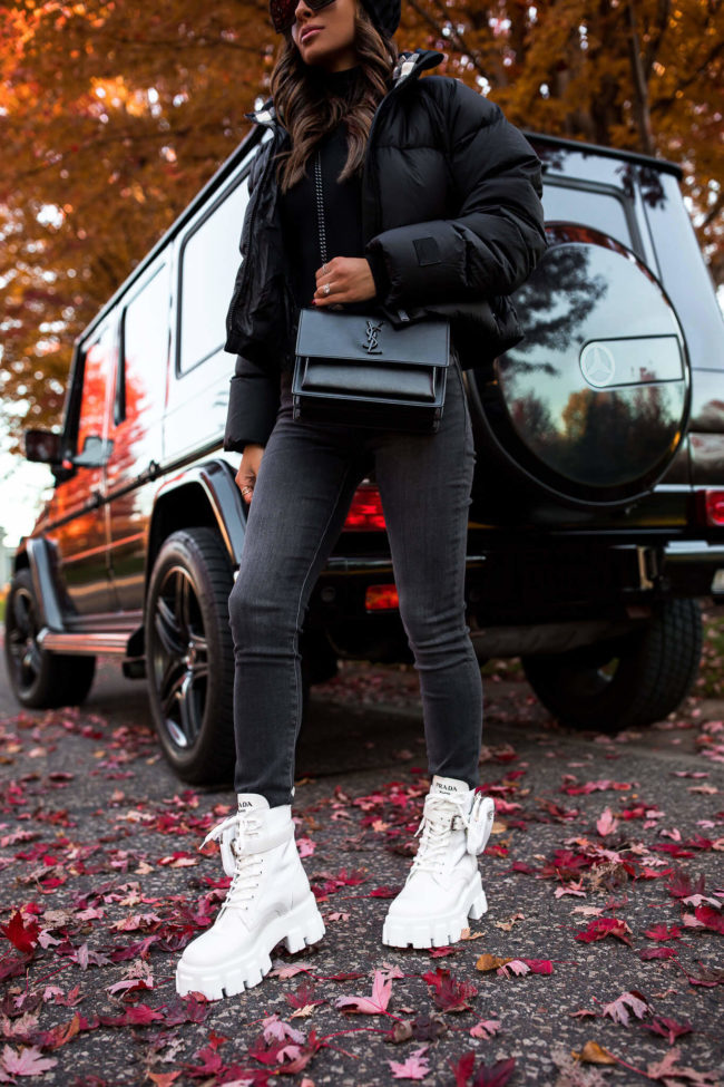fashion blogger mia mia mine wearing white prada lug sole boots and frame denim from neiman marcus