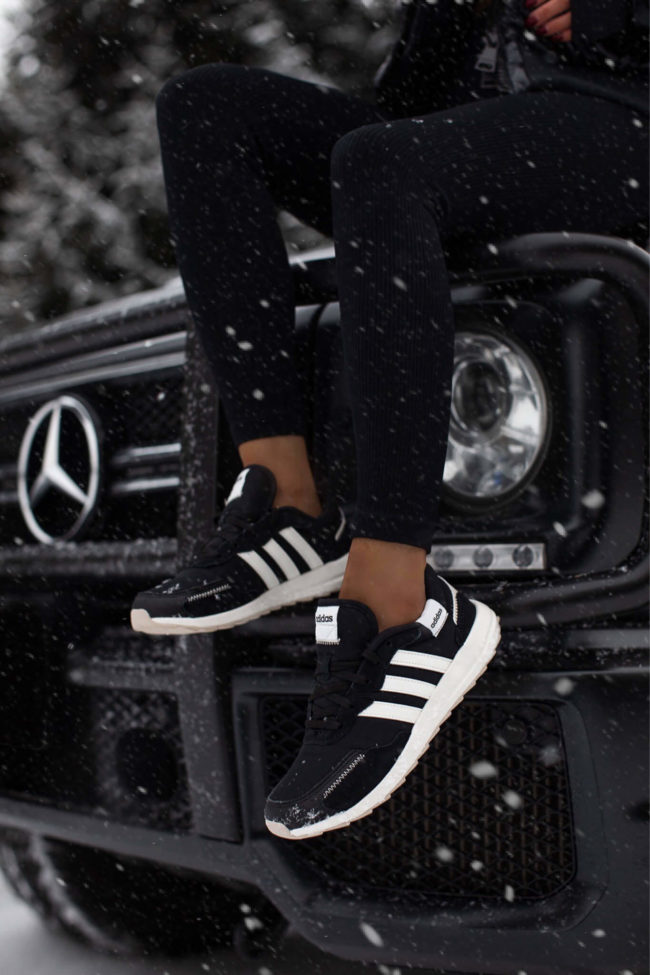 fashion blogger wearing adidas sneakers from dsw