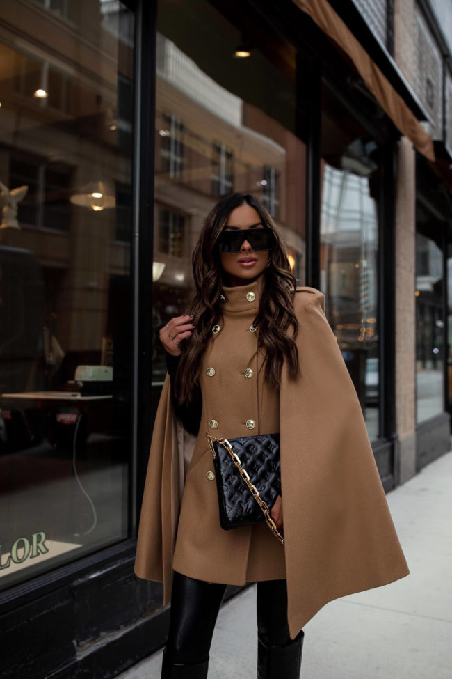 fashion blogger wearing a camel cape from karen millen
