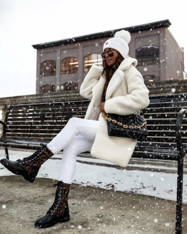fashion blogger wearing a white faux fur coat from abercrombie