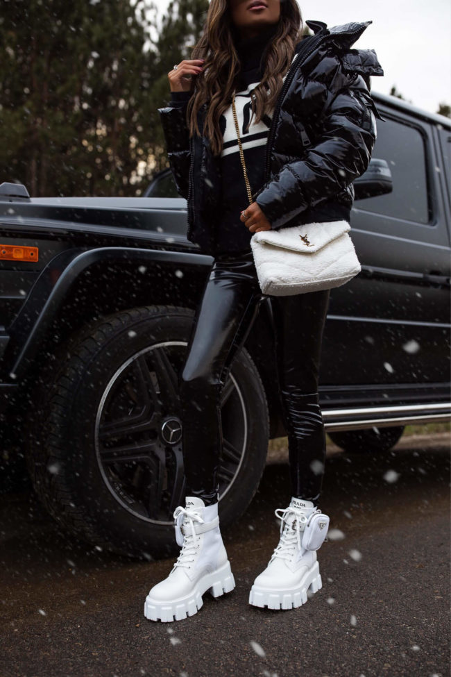 fashion blogger wearing prada combat boots from saks