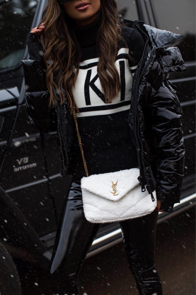 fashion blogger wearing a saint laurent boucle tiny toy puffer bag