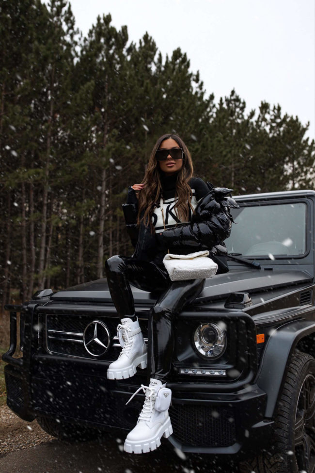 fashion blogger mia mia mine wearing a ski sweater and commando patent leather leggings for winter