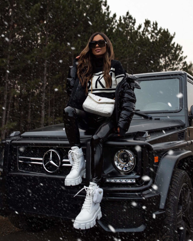 fashion blogger mia mia mine wearing white prada monolith boots from saks