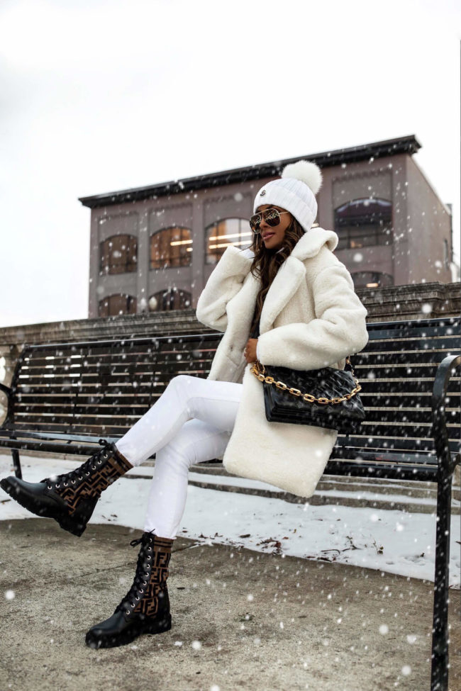 fashion blogger wearing a white faux fur coat from abercrombie