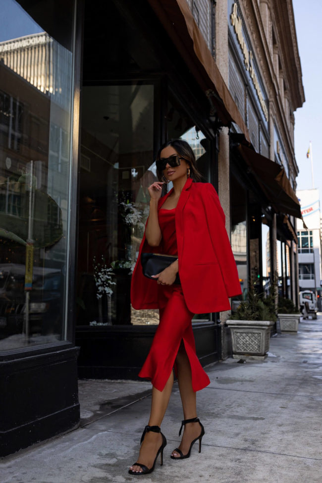 fashion blogger mia mia mine wearing a red dress from Express