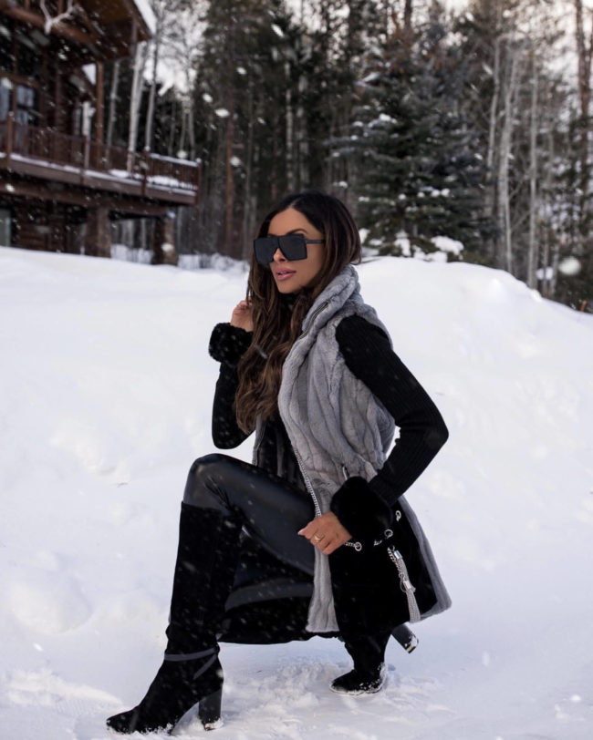 fashion blogger wearing a faux fur vest from whbm