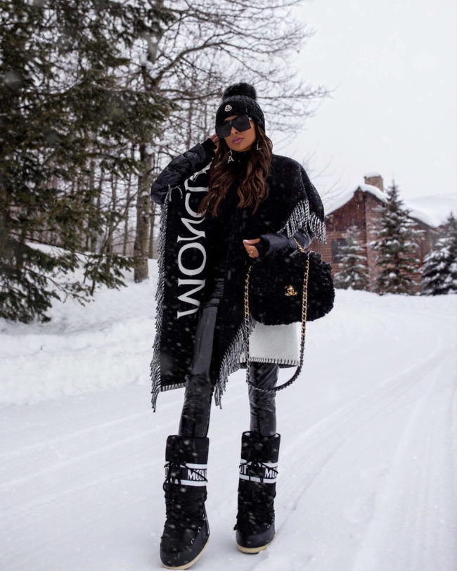 fashion blogger mia mia mine wearing moon boots and a moncler poncho puffer jacket