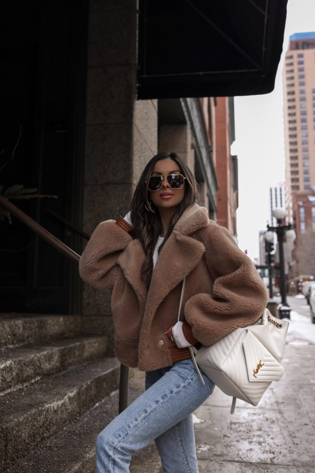 fashion blogger mia mia mine wearing a white saint laurent backpack from nordstrom