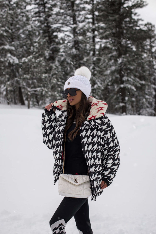 fashion blogger mia mia mine wearing a perfect moment ski suit from saks fifth avenue