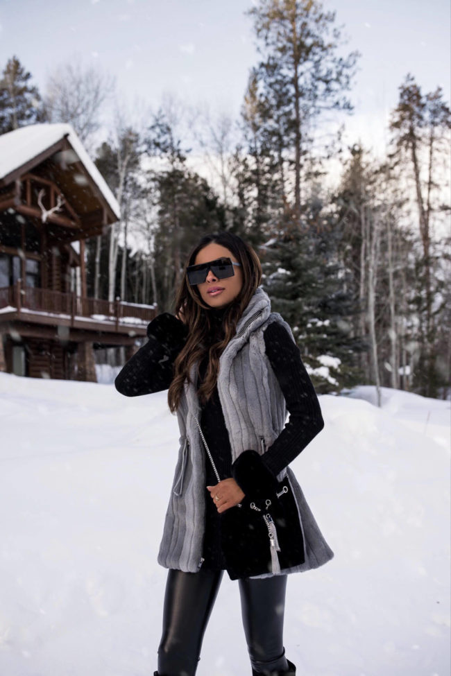fashion blogger wearing a gray faux fur vest in jackson hole wyoming