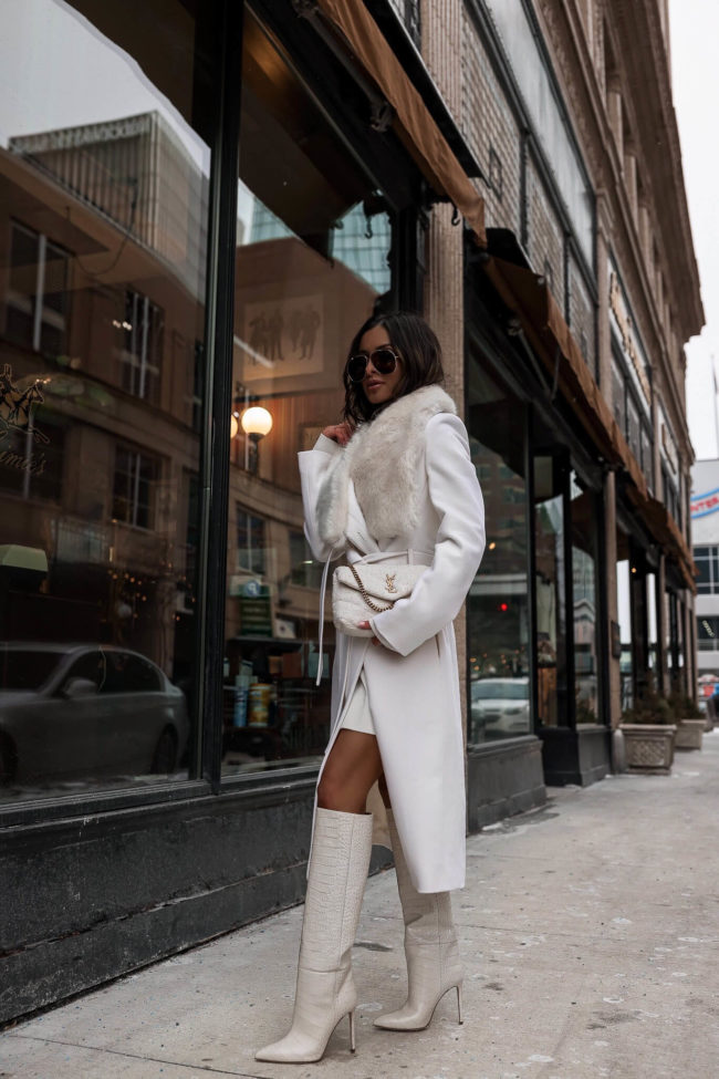 fashion blogger mia mia mine wearing a white faux fur coat from karen millen for winter 2022