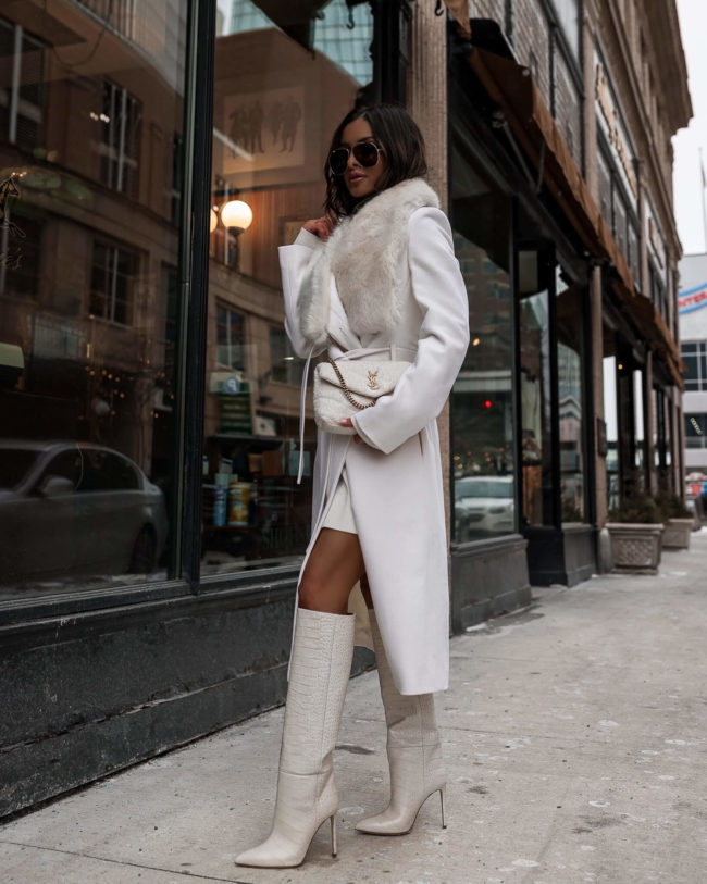 fashion blogger mia mia mine wearing a white faux fur coat from karen millen for winter 2022