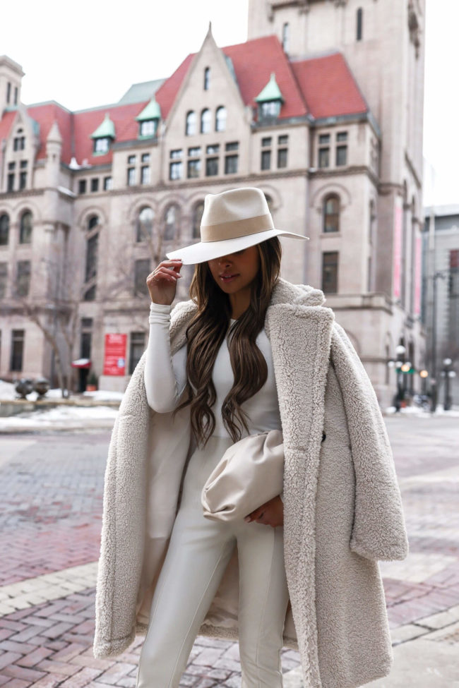 fashion blogger mia mia mine wearing a white winter outfit from nordstrom