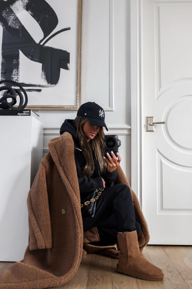 fashion blogger wearing ugg boots and a max mara coat for winter