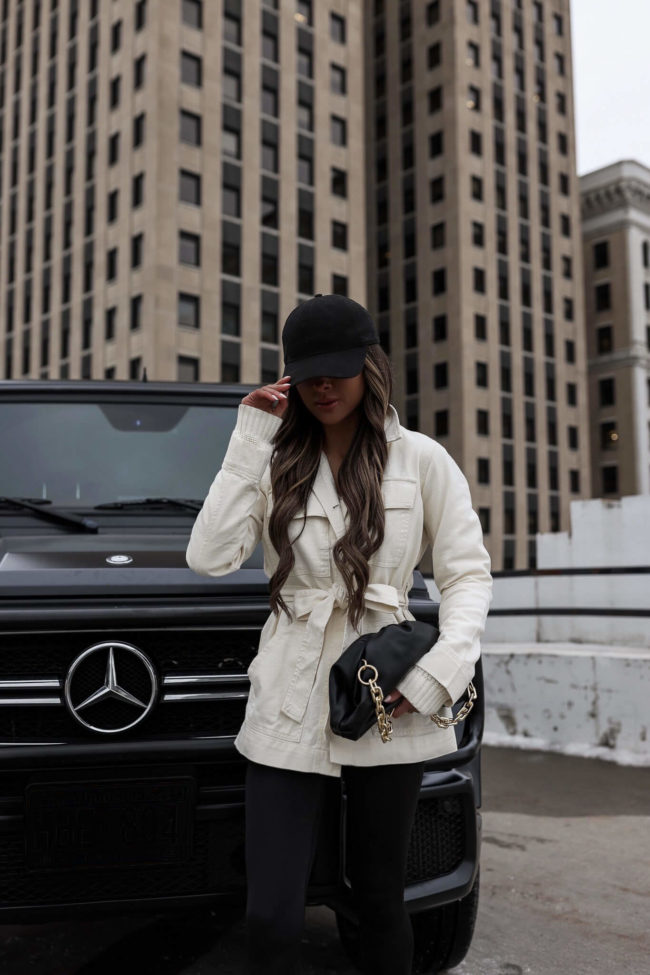 fashion blogger mia mia mine wearing black leggings and black running shoes from walmart