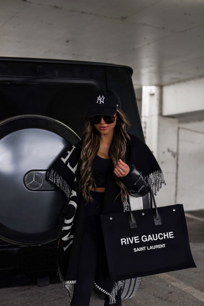fashion blogger wearing a black rive gauche tote from mytheresa