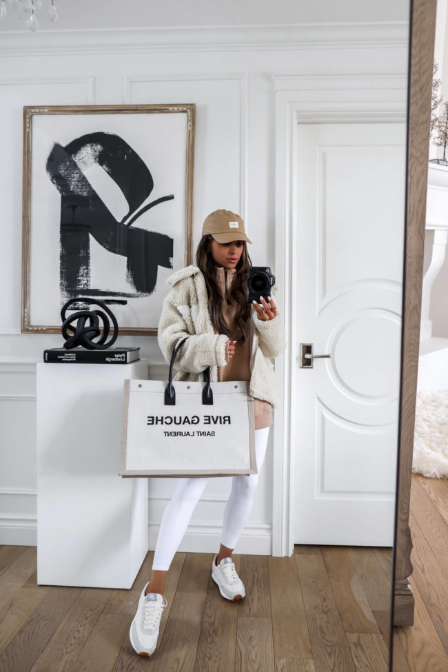fashion blogger wearing a white nike fleece jacket from nordstrom