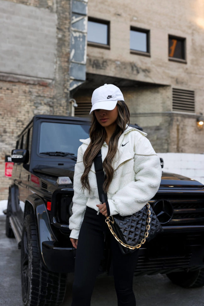 fashion blogger wearing a nike white fleece from nordstrom