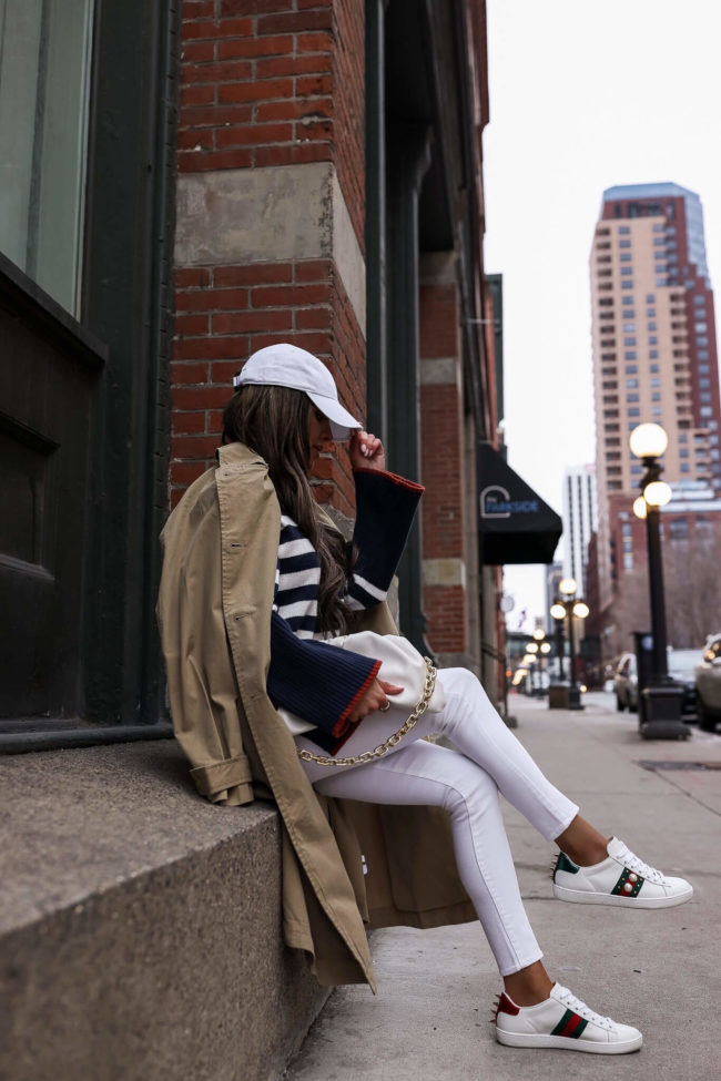 fashion blogger mia mia mine wearing a striped sweater from walmart and white denim