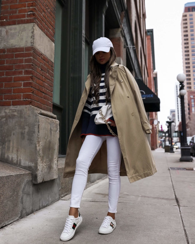 fashion blogger wearing a trench coat and striped sweater from walmart